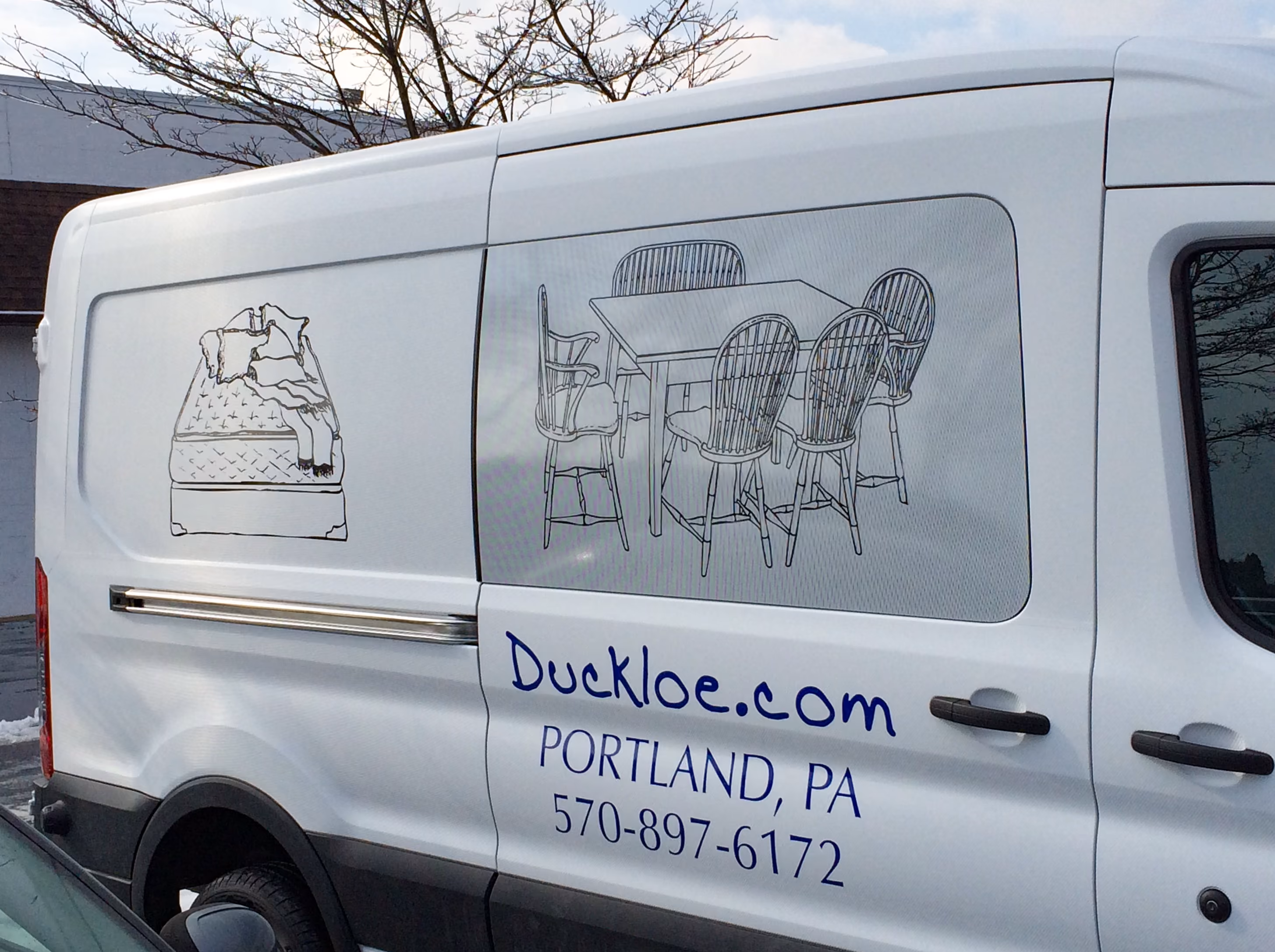 Furniture delivery truck with custom vinyl lettering and graphics