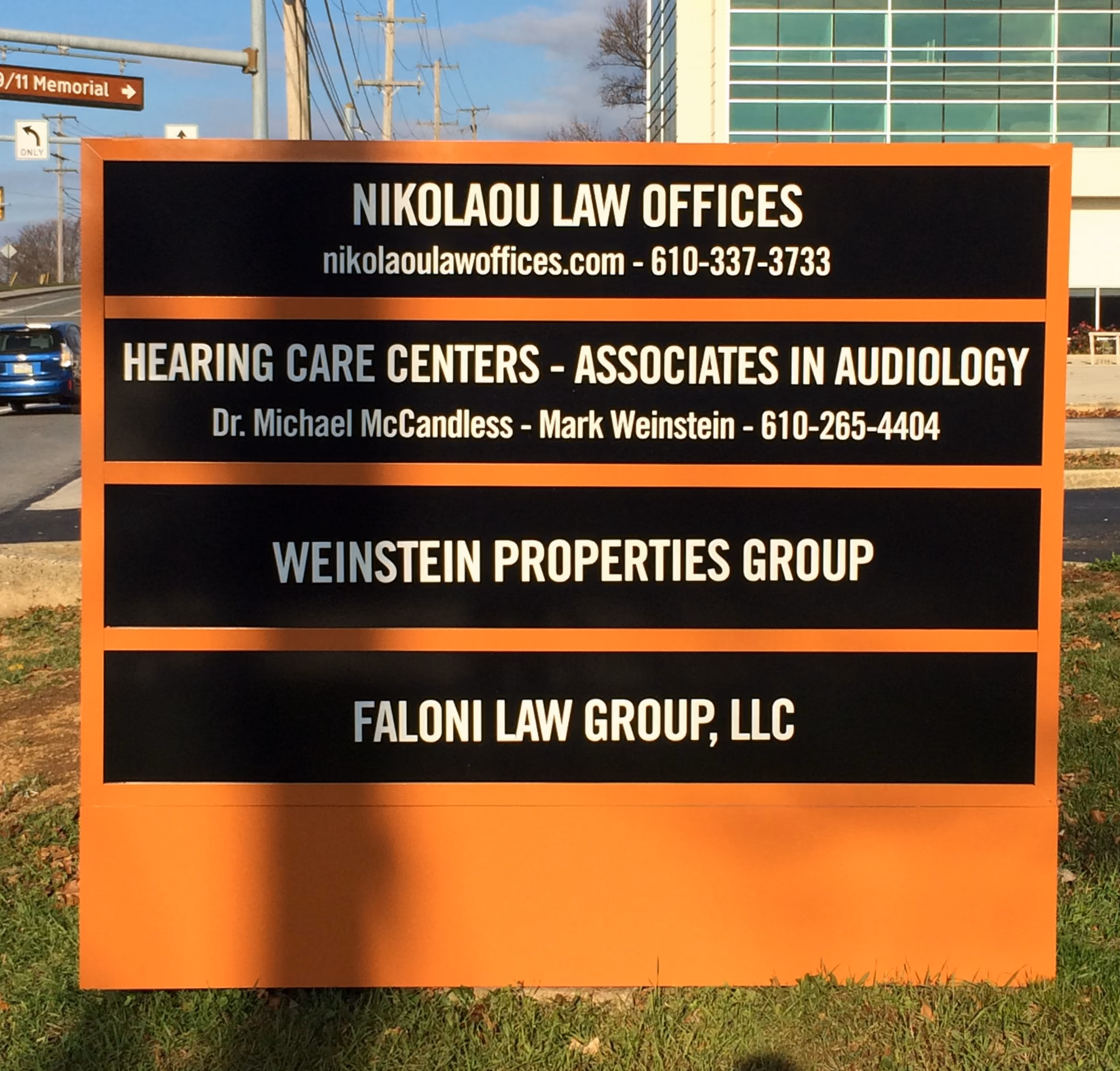 Multi-panel building directory on a monument sign