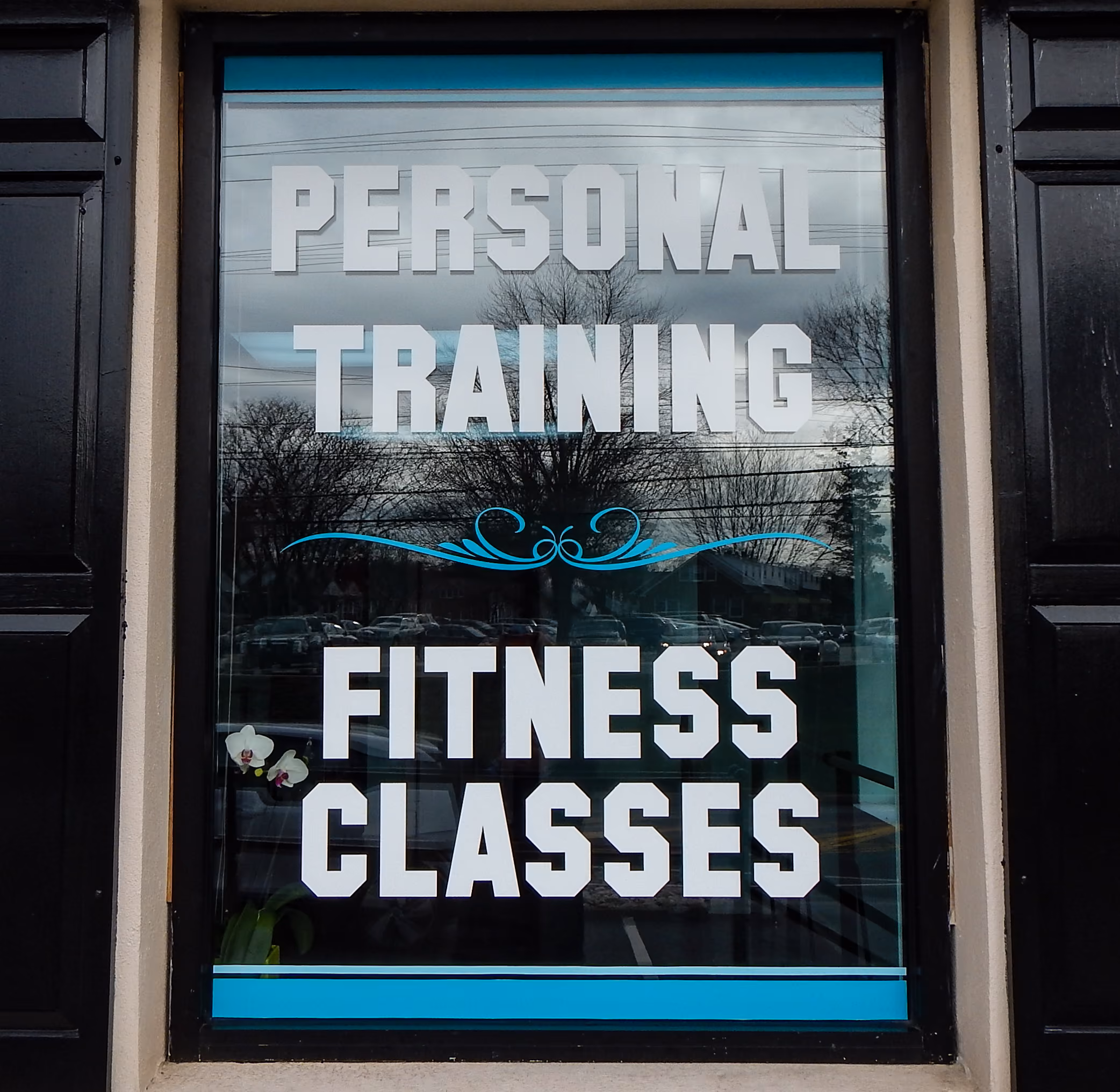 Custom vinyl lettering on a gym window