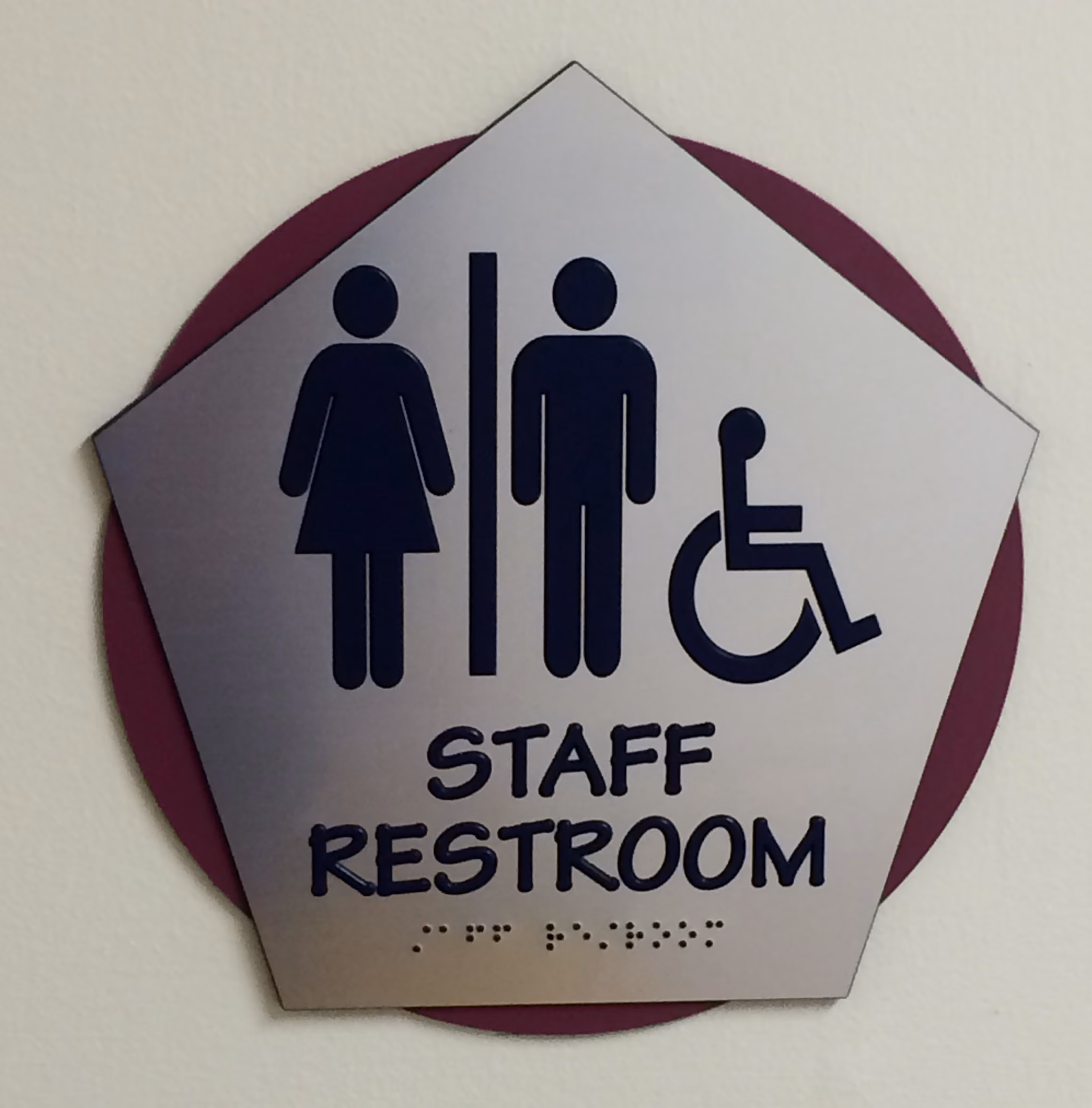 Custom ADA restroom sign made from brushed aluminum
