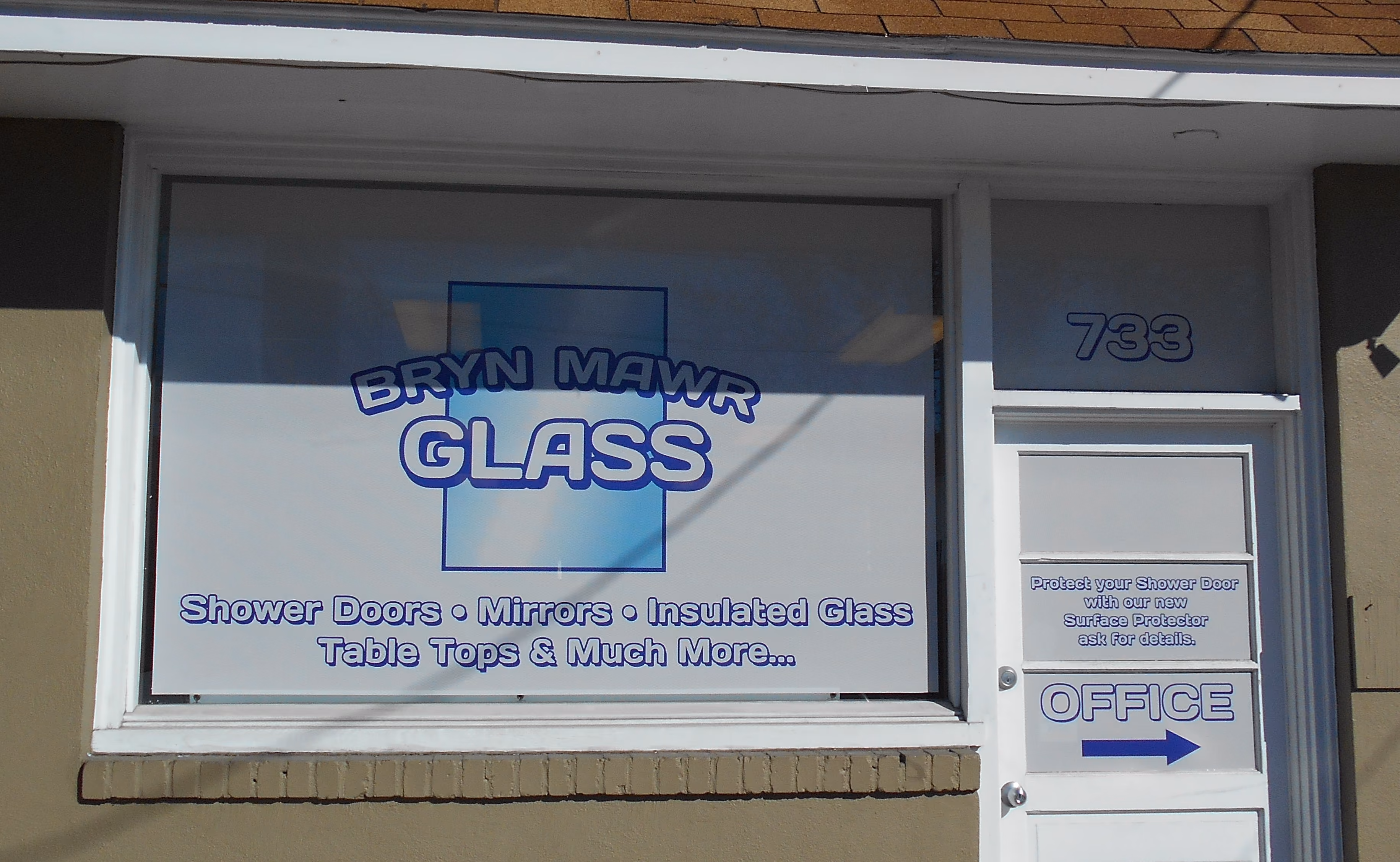 Full vinyl privacy sign on storefront windows and door