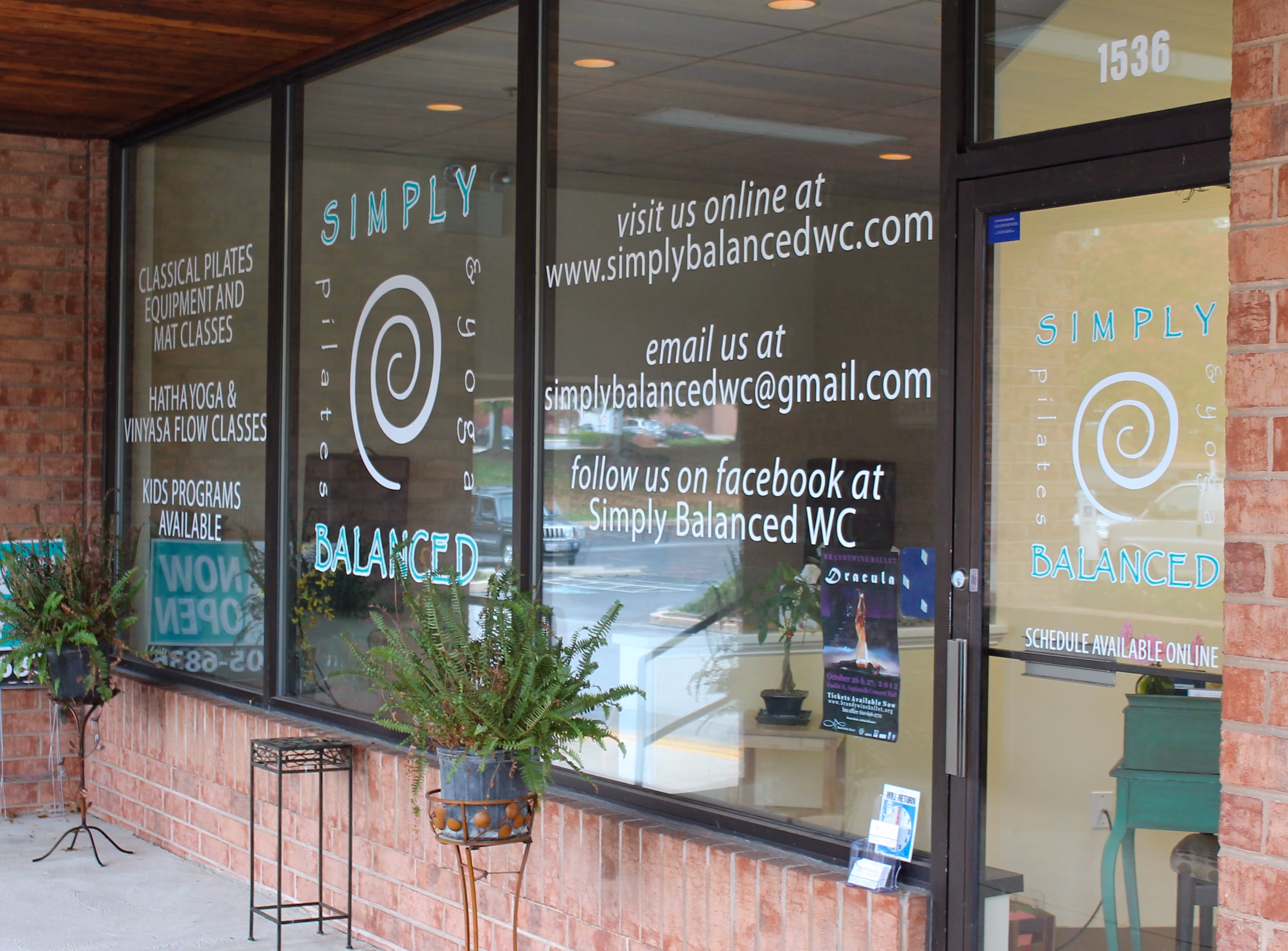 Custom vinyl lettering in a yoga studio window