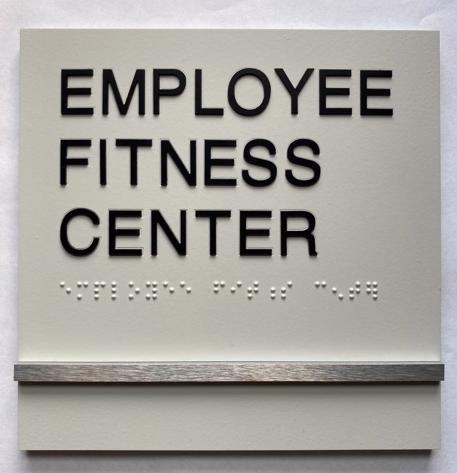 Custom ADA room sign made from acrylic and aluminum accent pieces