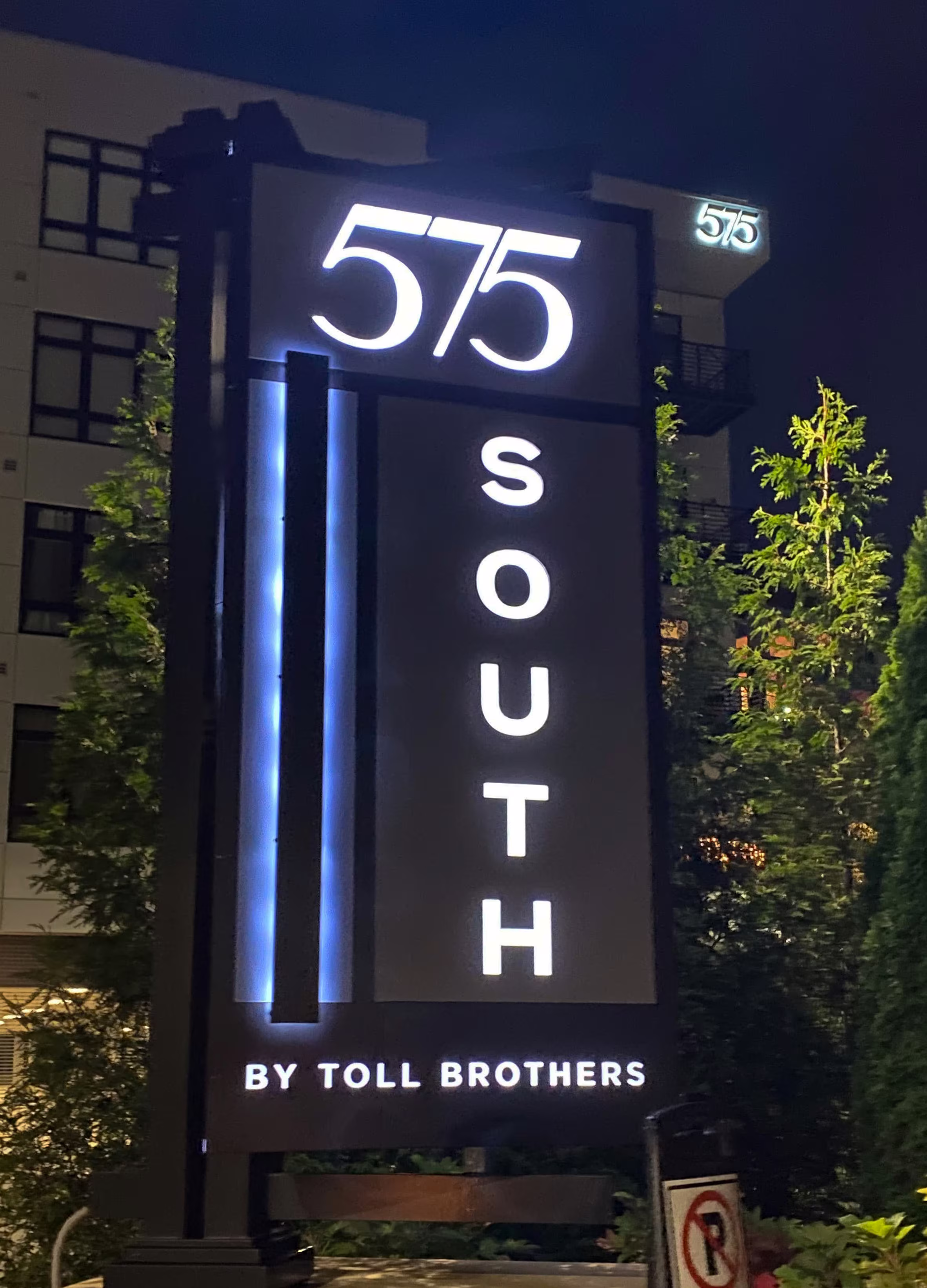 Large internally illuminated monument sign for an apartment building