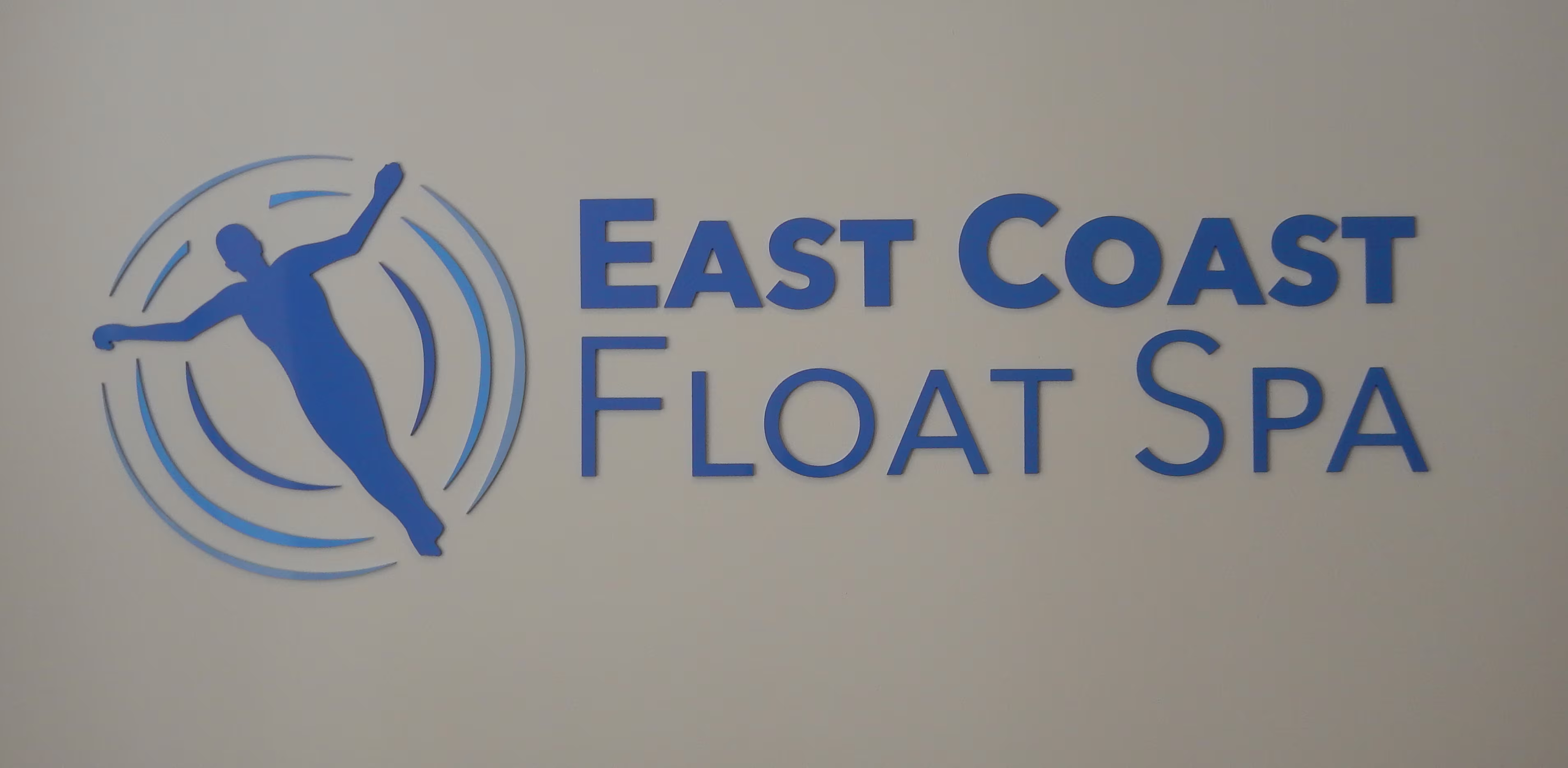 Painted acrylic dimensional letters and logo mounted with VHB tape