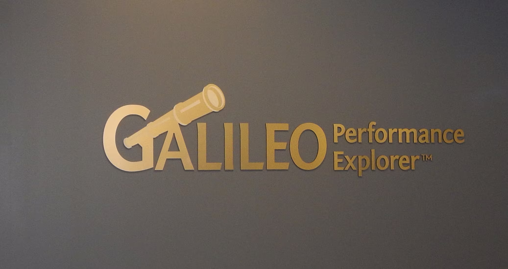 First-surface vinyled-dimensional letters on a gray wall
