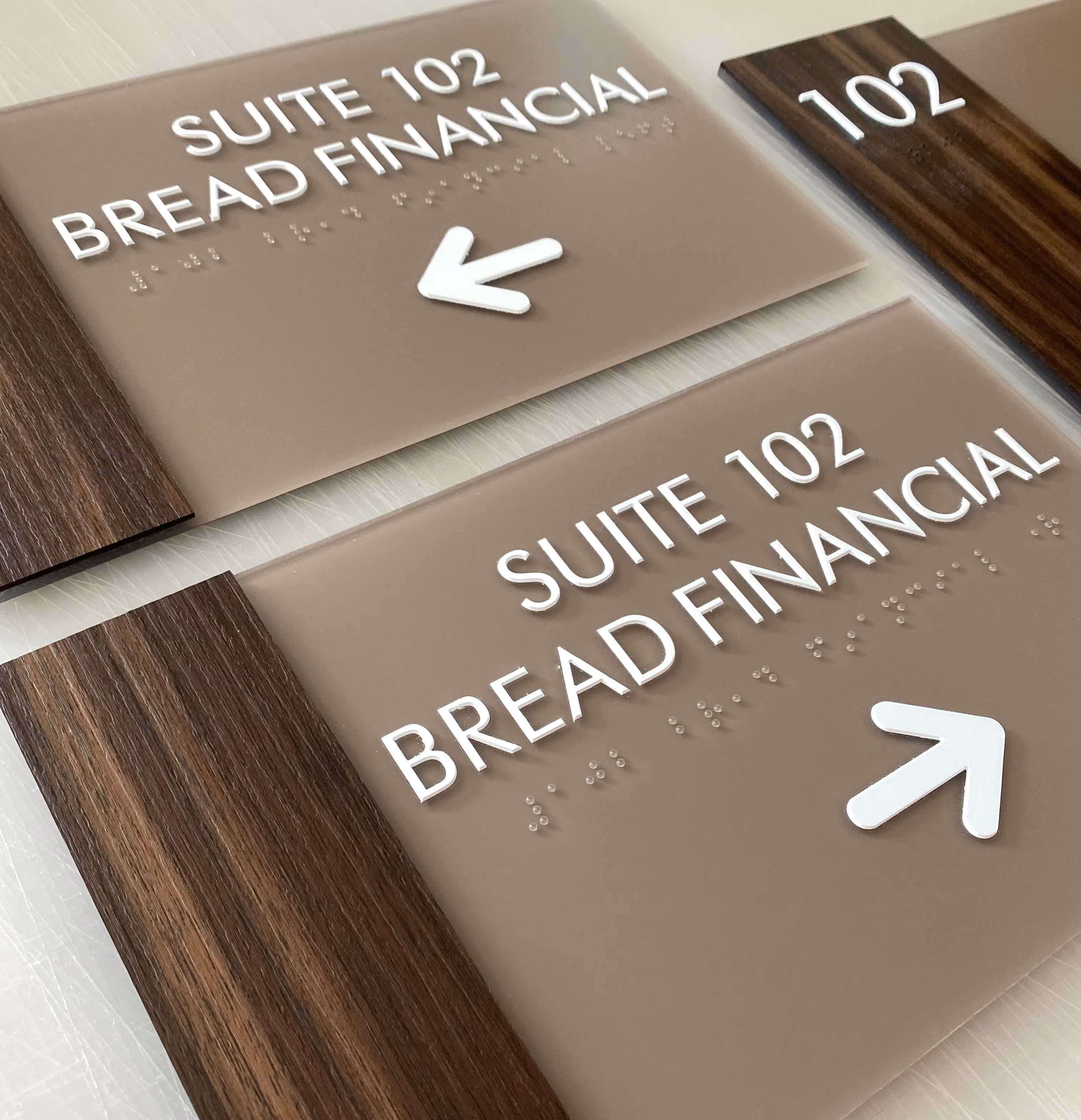 Custom ADA suite signs with faux wood accent piece