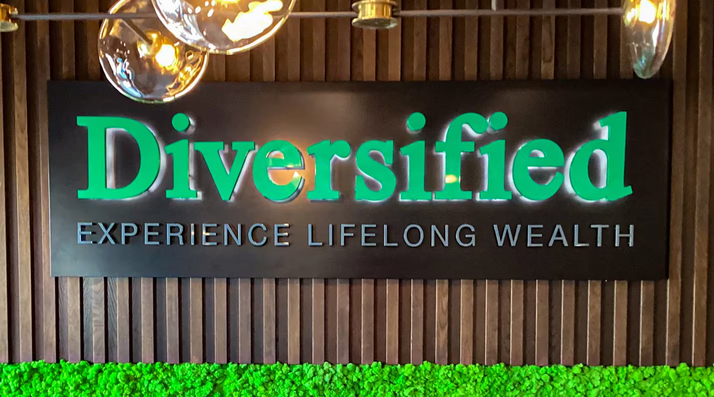 Green, combination face-lit and halo-lit channel letters on an interior wall sign
