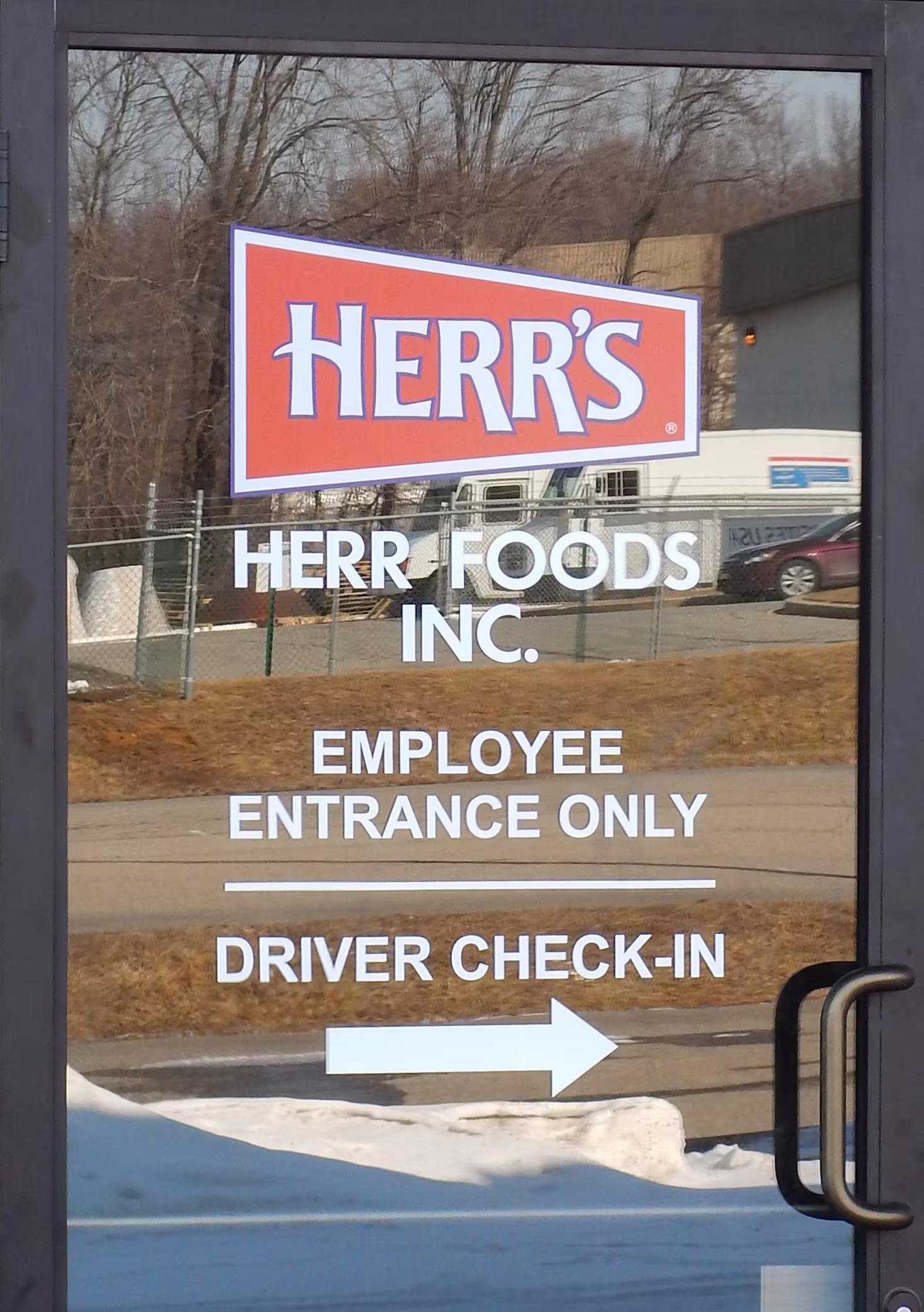 Custom plotted vinyl lettering on an employee entrance door