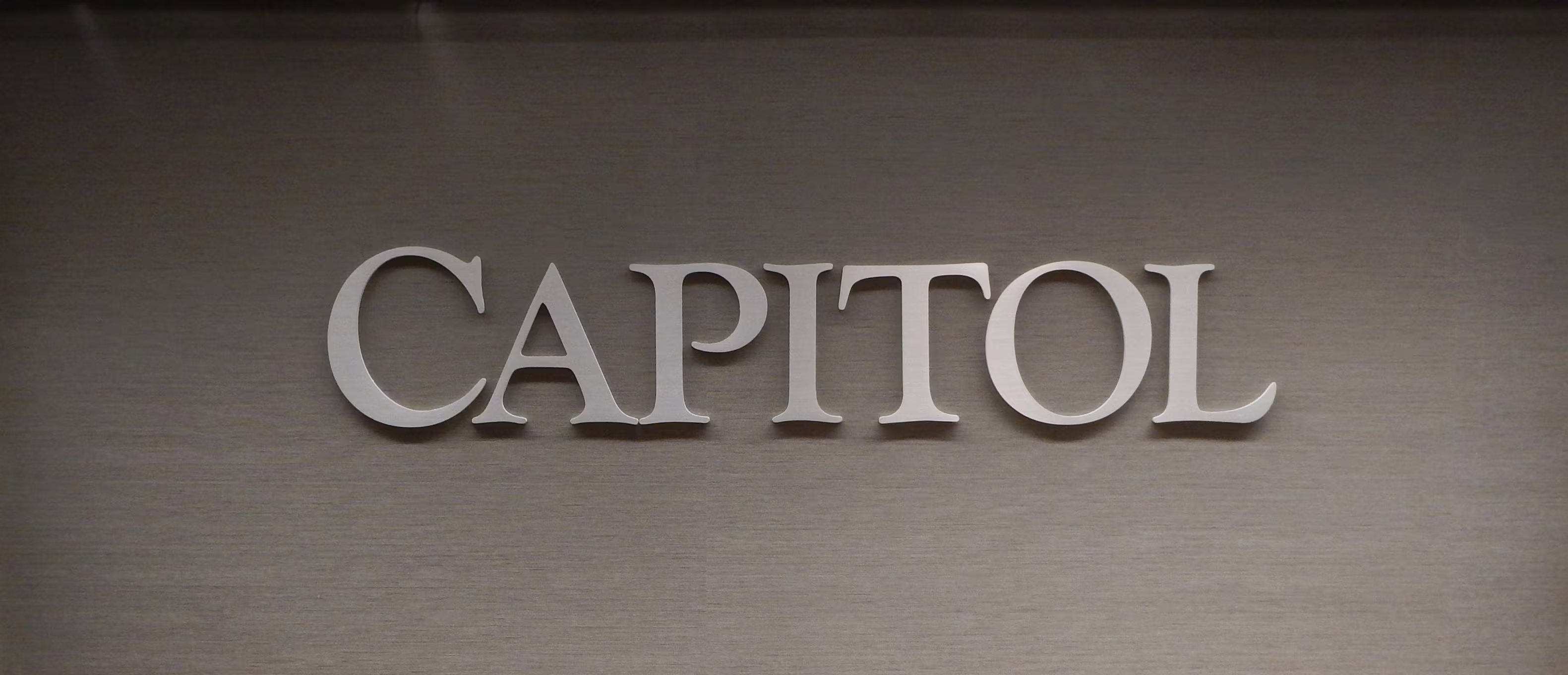 Brushed aluminum dimensional letters mounted on spacers
