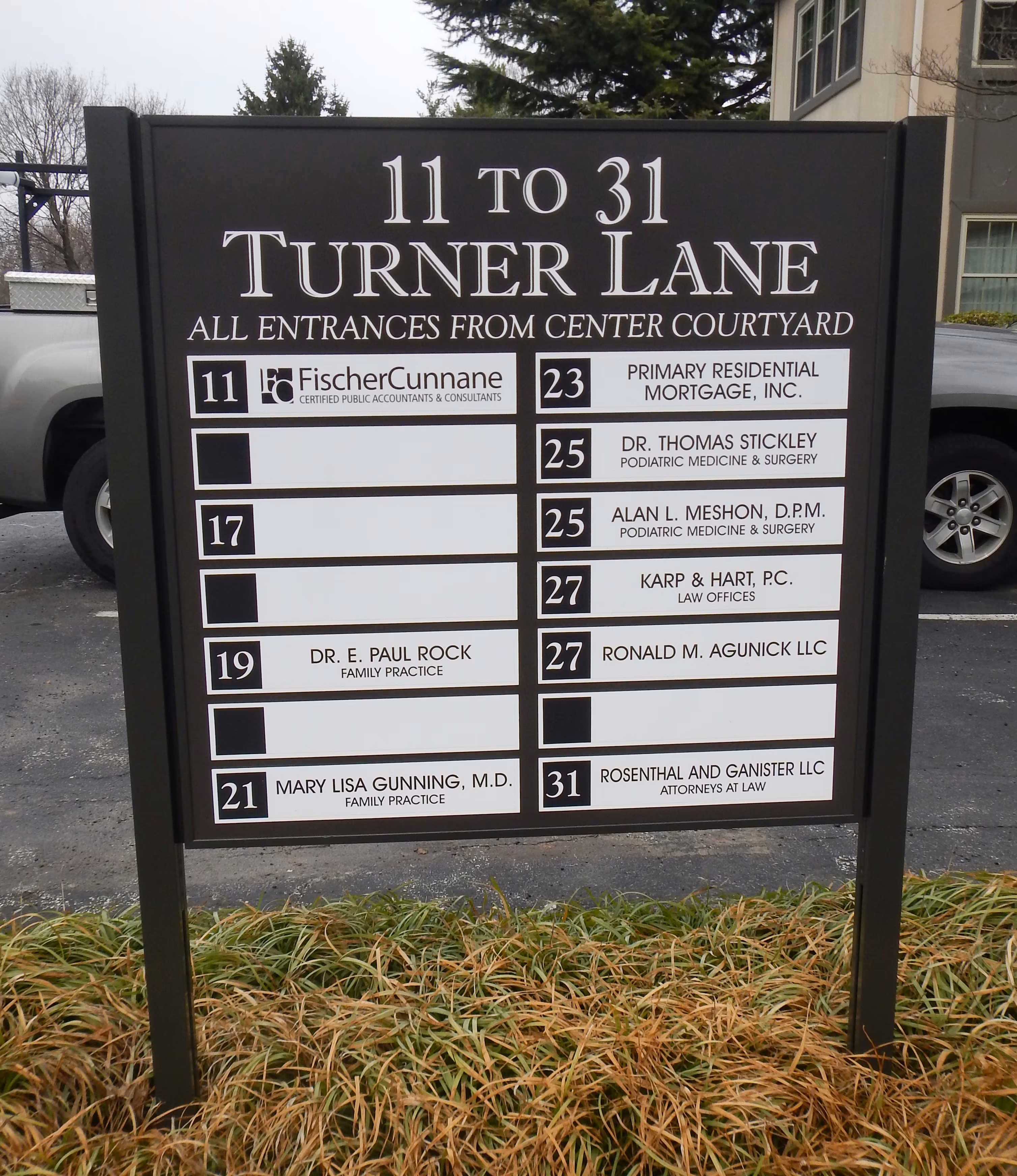 Campus directory on a brown post and panel sign