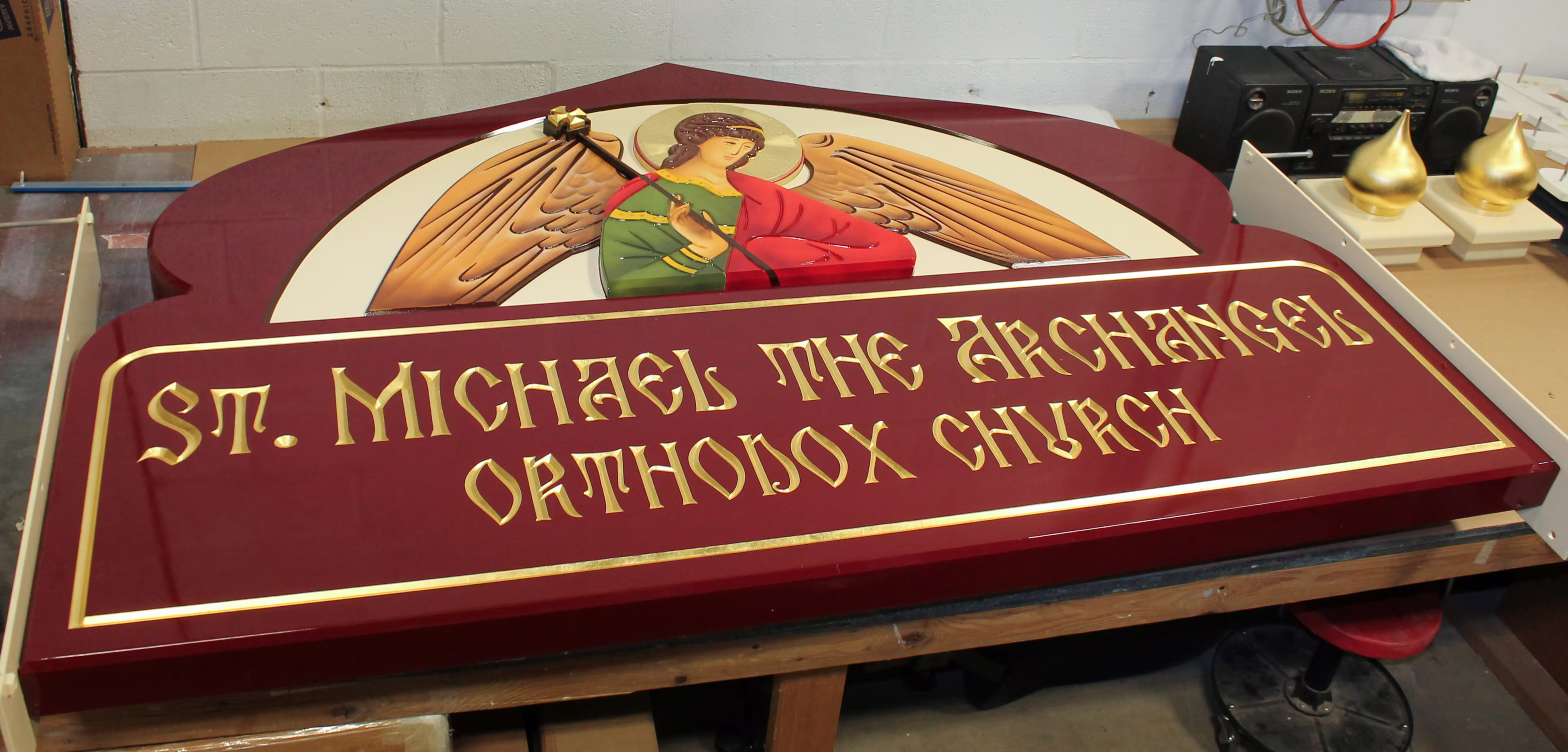 Single-sided, custom carved HDU sign with detailed graphic