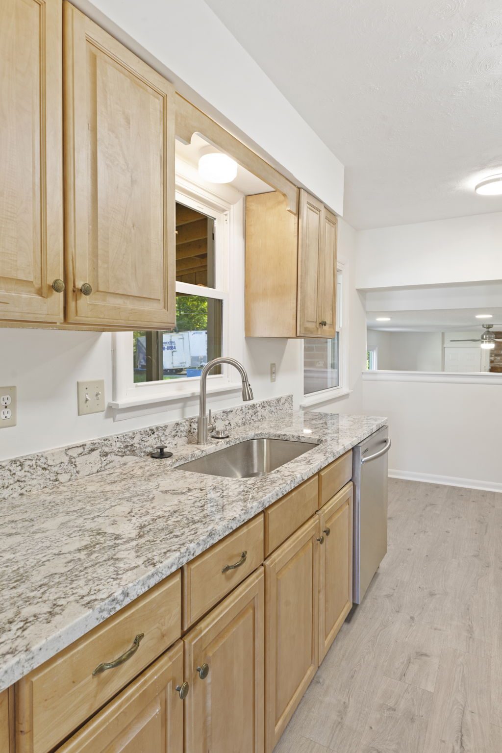 Bright, finished open-plan living room and kitchen interior remodel