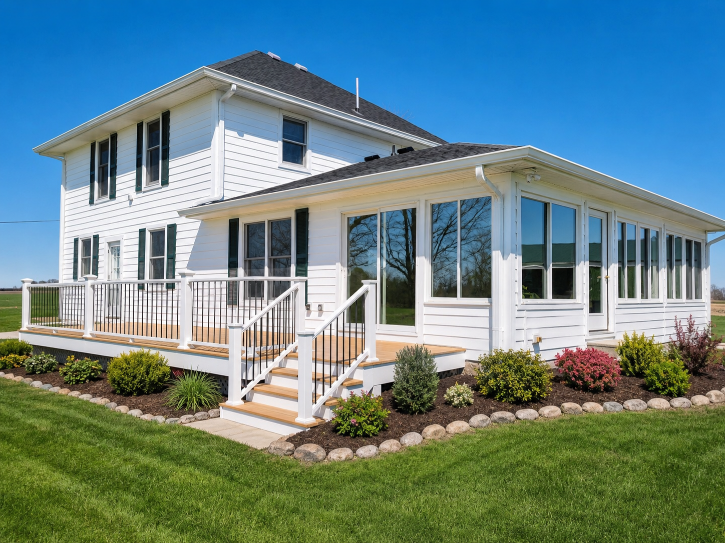 Home exterior with large windows and doors by JCZ Residential in Central Indiana