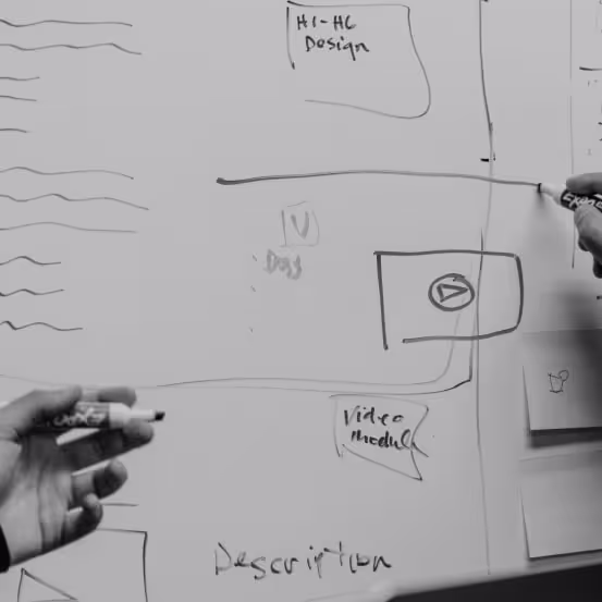 people are writing on white board