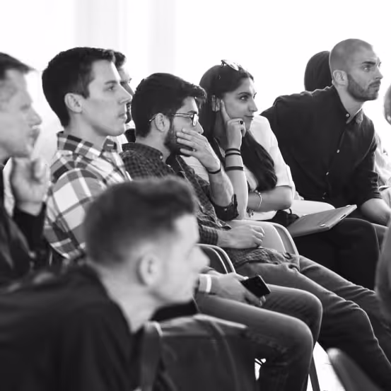 a group of people sitting next to each other