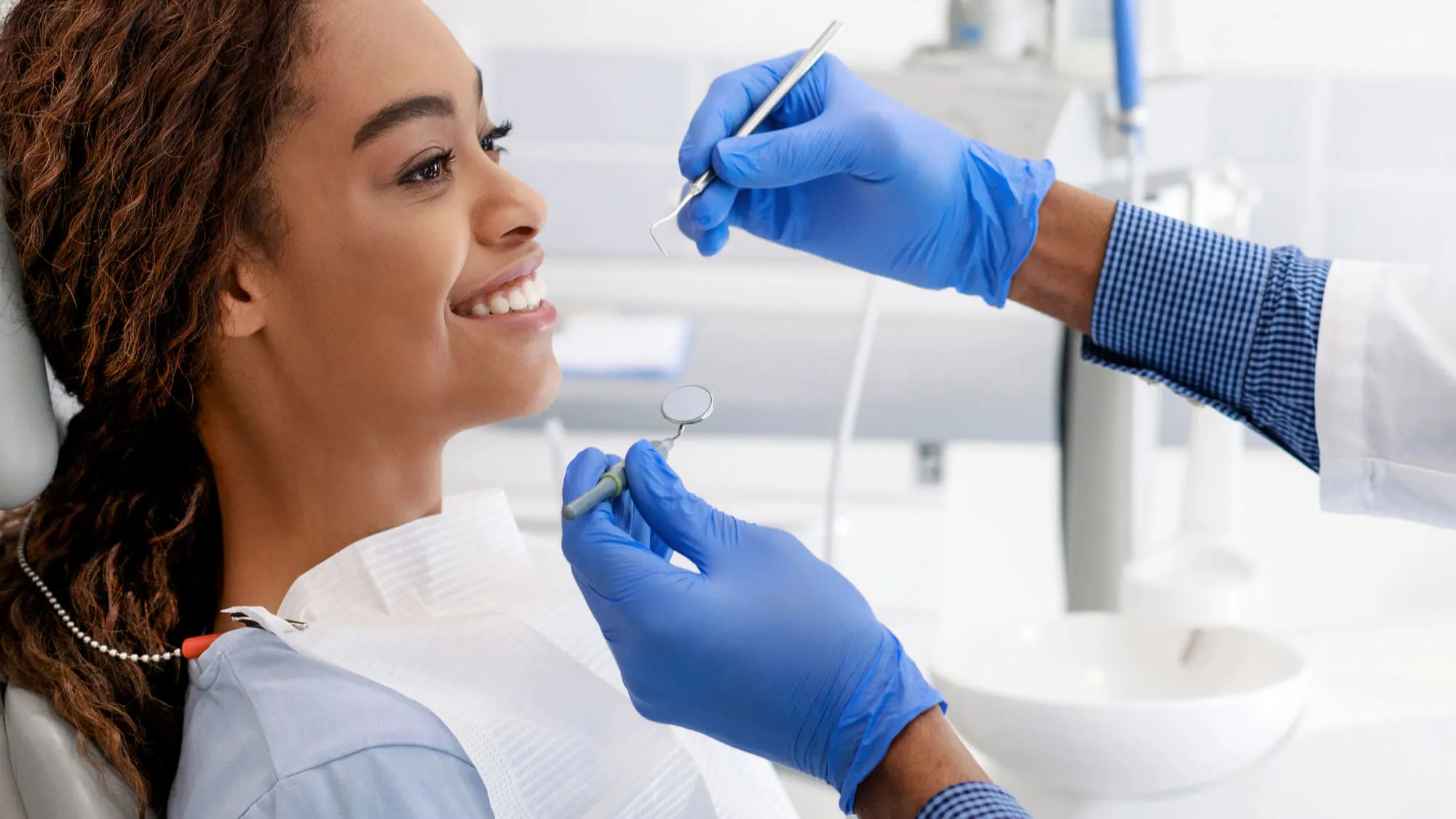 dentist in norristown pa performing dental exam