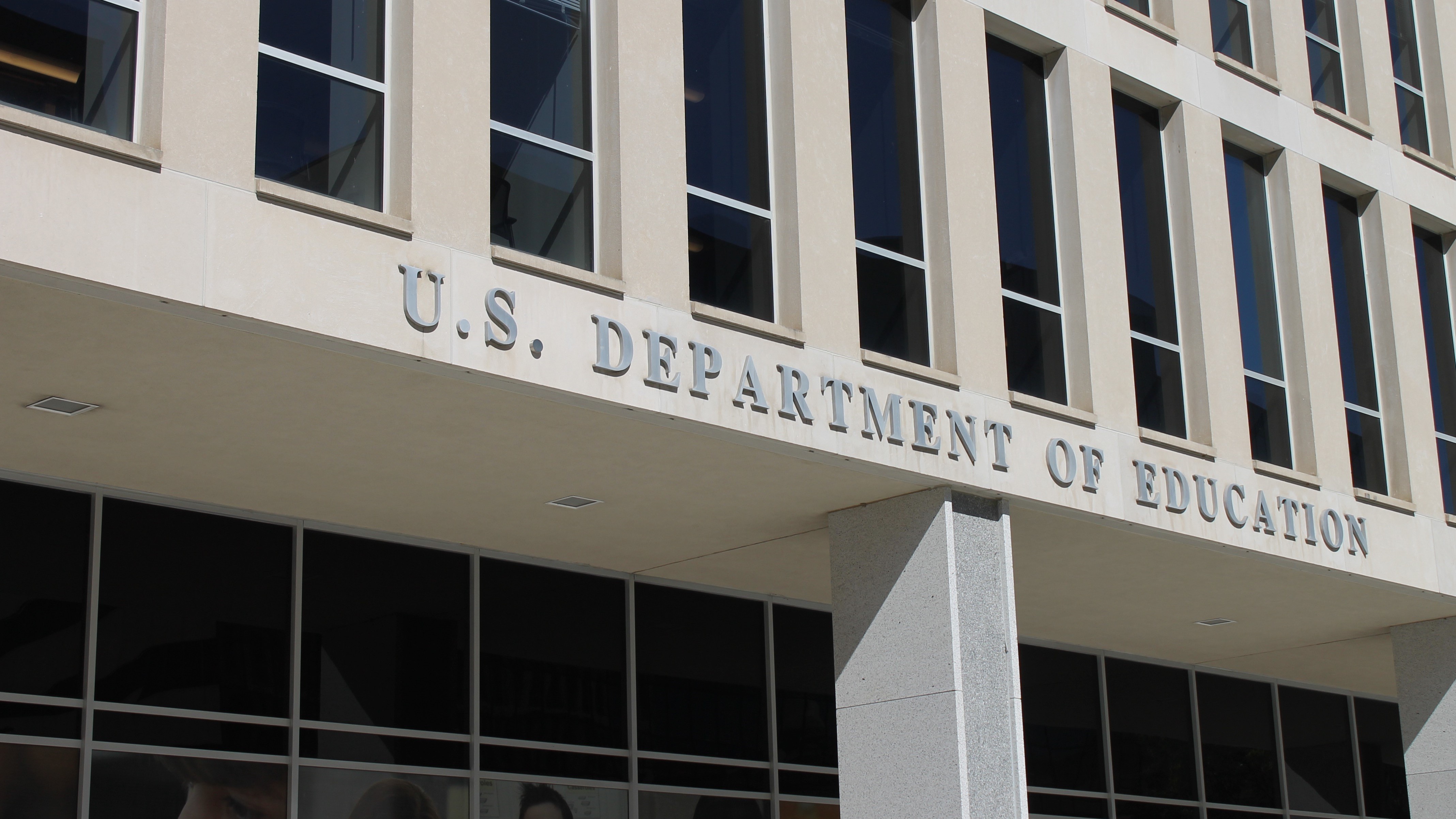 image of a teacher interacting with students using digital tools