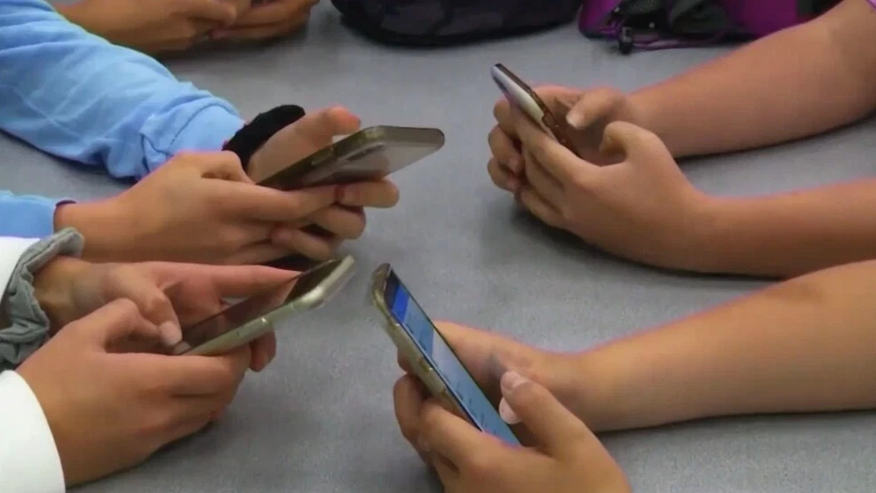 image of a teacher interacting with students using digital tools