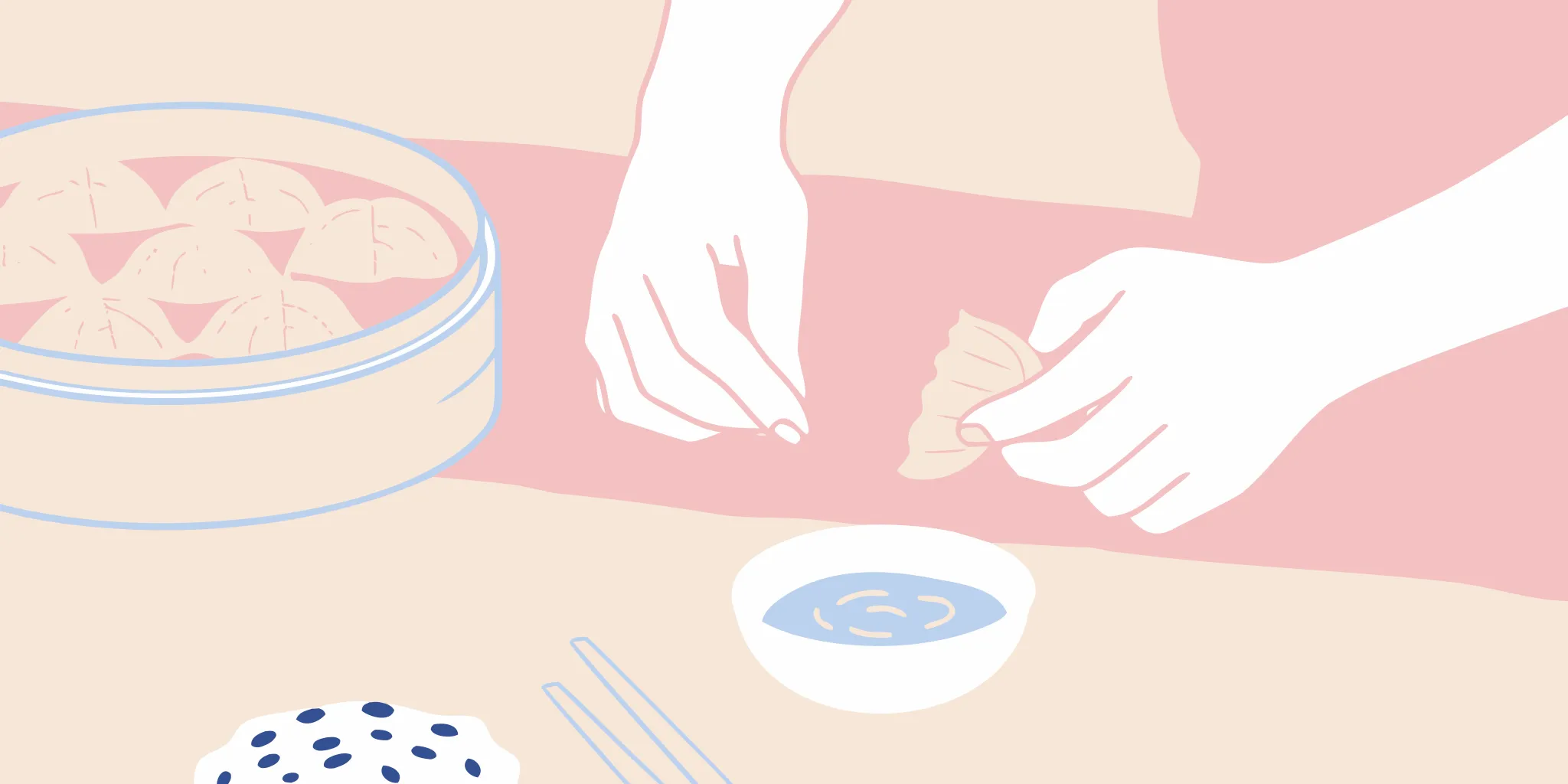 Hands folding homemade gyoza dumplings next to a dipping sauce and a steamer of cooked dumplings.