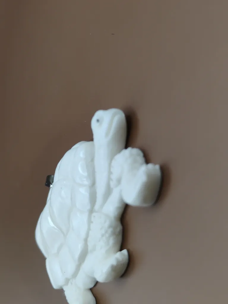 Pendentif os luxe tortue vue près