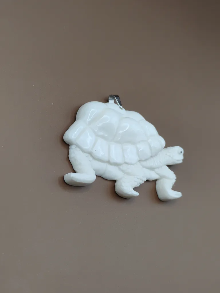 Pendentif os luxe tortue vue gauche