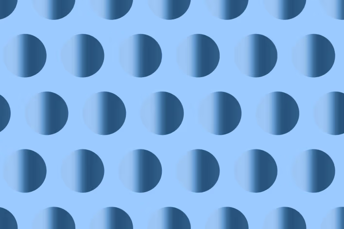 Uniform grid of large three-dimensional spheres with consistent gradient shading, arranged in evenly spaced diagonal rows across the composition.
