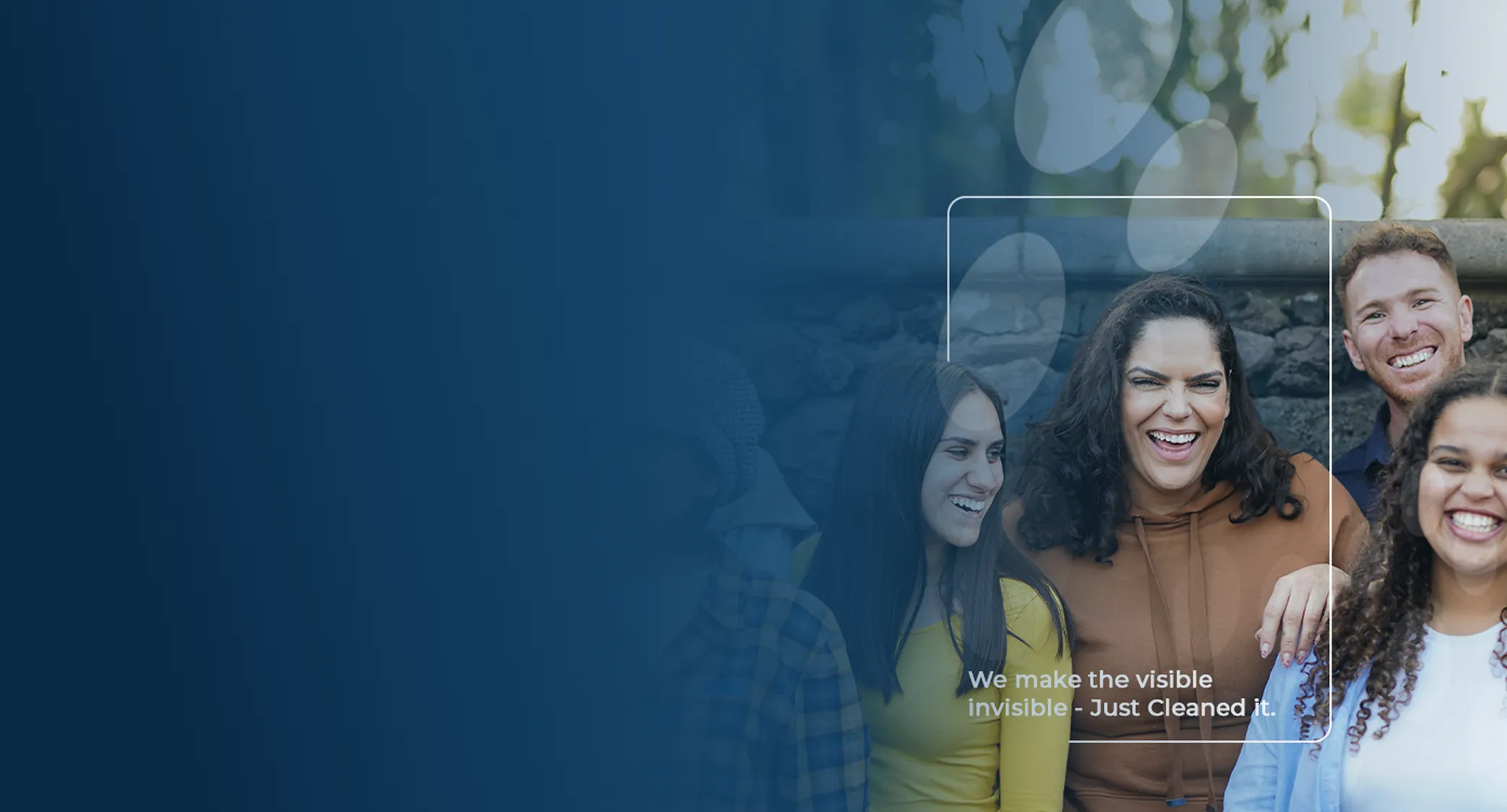 Group of diverse young adults smiling and standing outdoors against a stone wall with the text 'We make the visible invisible - Just Cleaned it.'