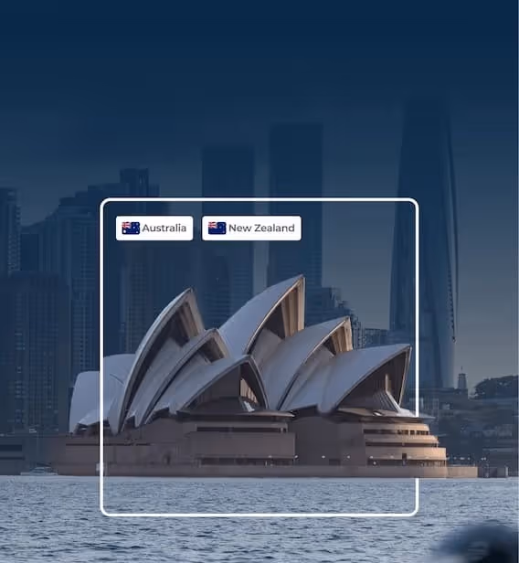 Sydney Opera House with city skyscrapers in the background during dusk, labeled with Australia and New Zealand flag icons.