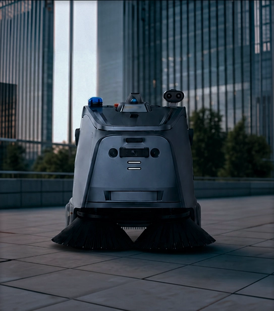Autonomous outdoor street cleaning robot on tiled pavement with buildings in the background.