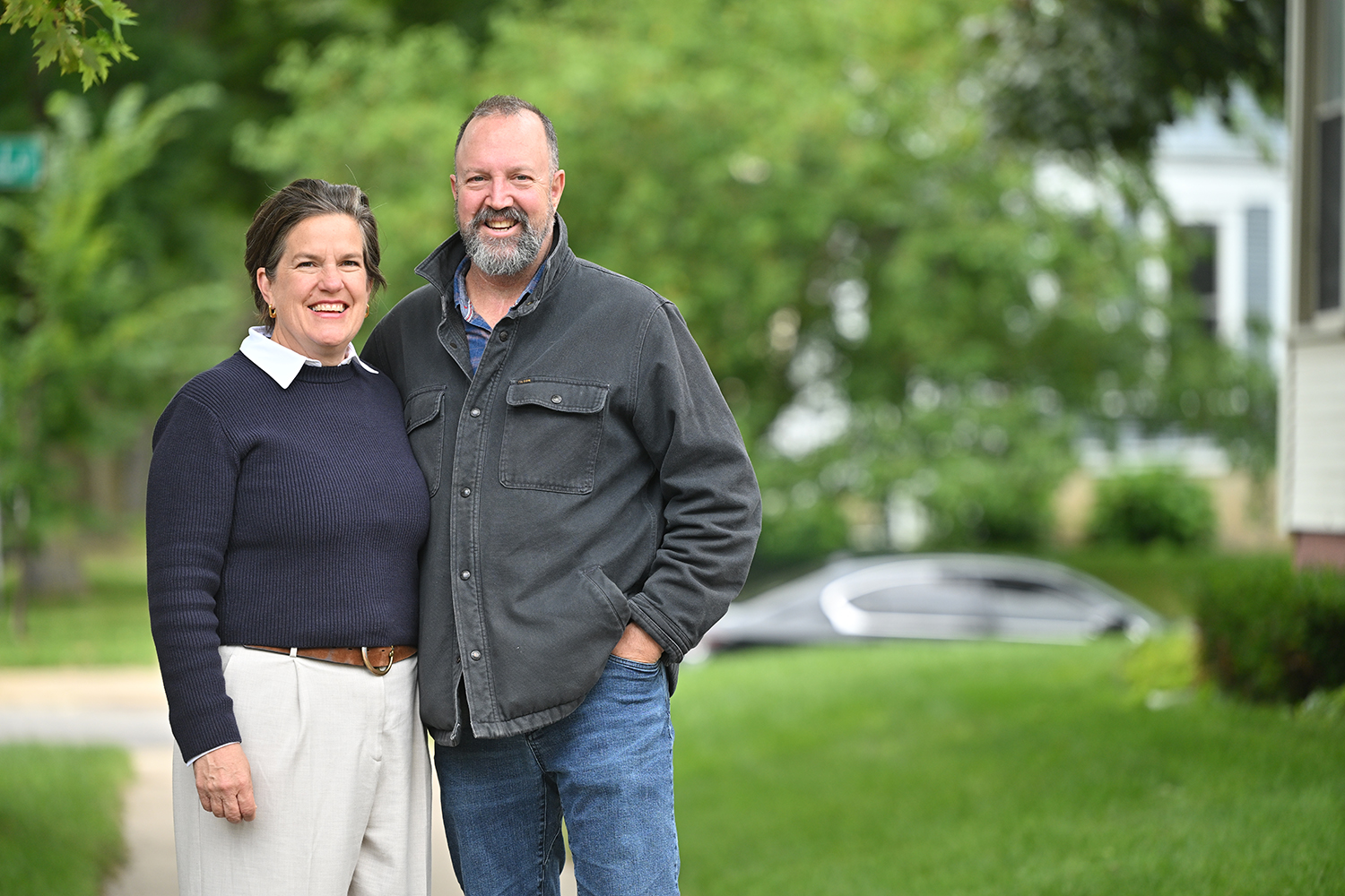 Missy Hughes with her husband, Tripp Hughes, standing together outside their home in Southwestern Wisconsin.