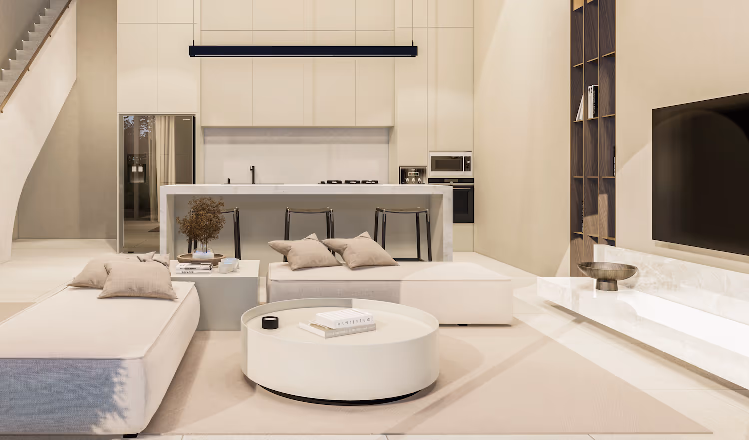 Modern open-plan living room and kitchen with beige sofas, round white coffee table, kitchen island with stools, and built-in appliances.