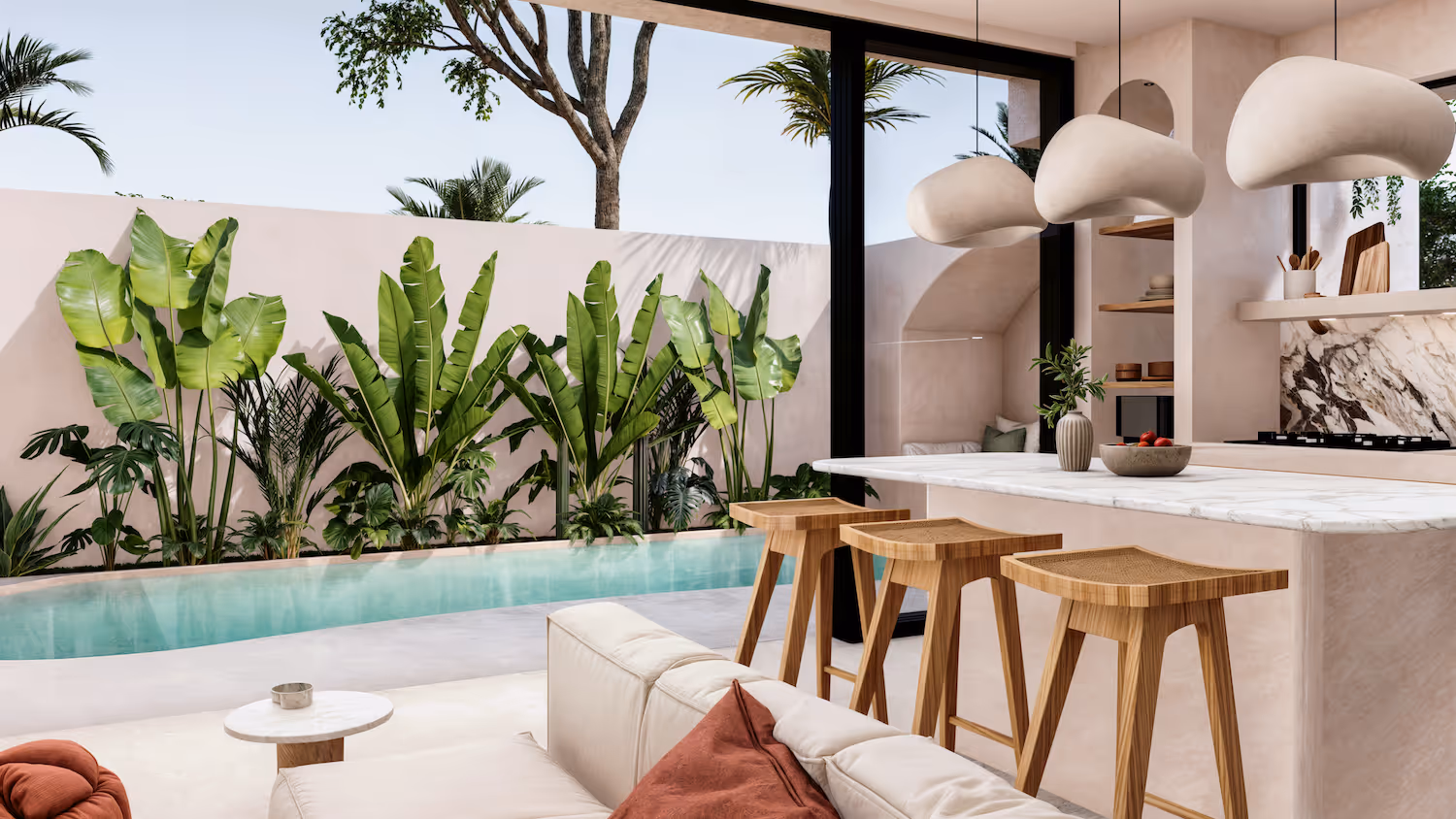 Modern open kitchen with marble countertop, wooden bar stools, and large glass doors opening to a pool and tropical plants outside.