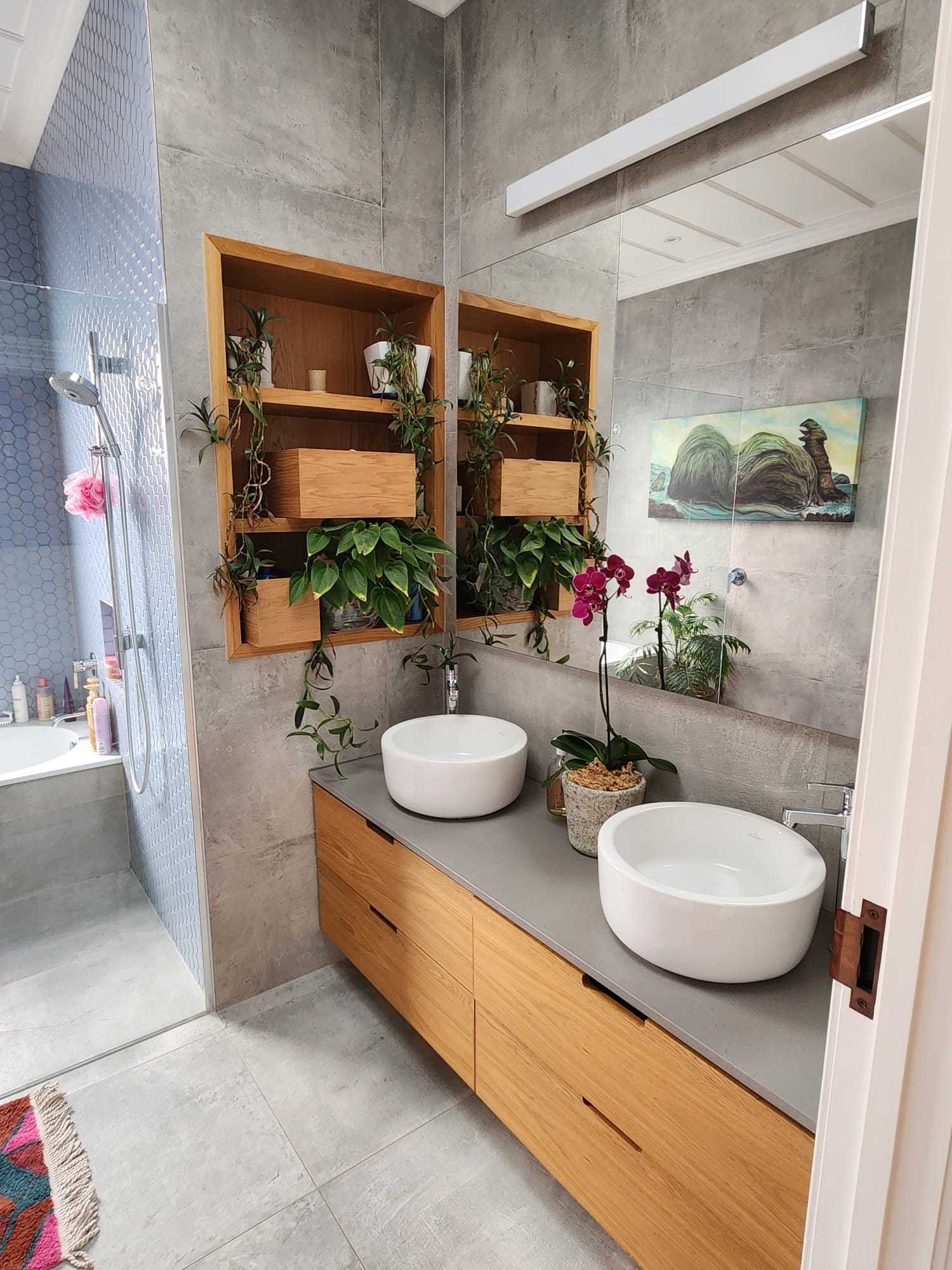 Modern architectural bathroom renovation featuring luxury tile and custom fixtures by Graham Mauger Builders Auckland