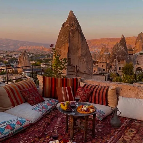 A living room with a couch and a table with food on it.
