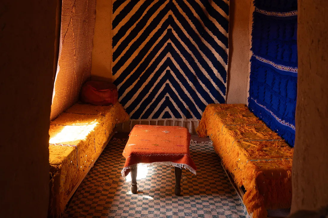 A couple of beds sitting next to each other in a room.