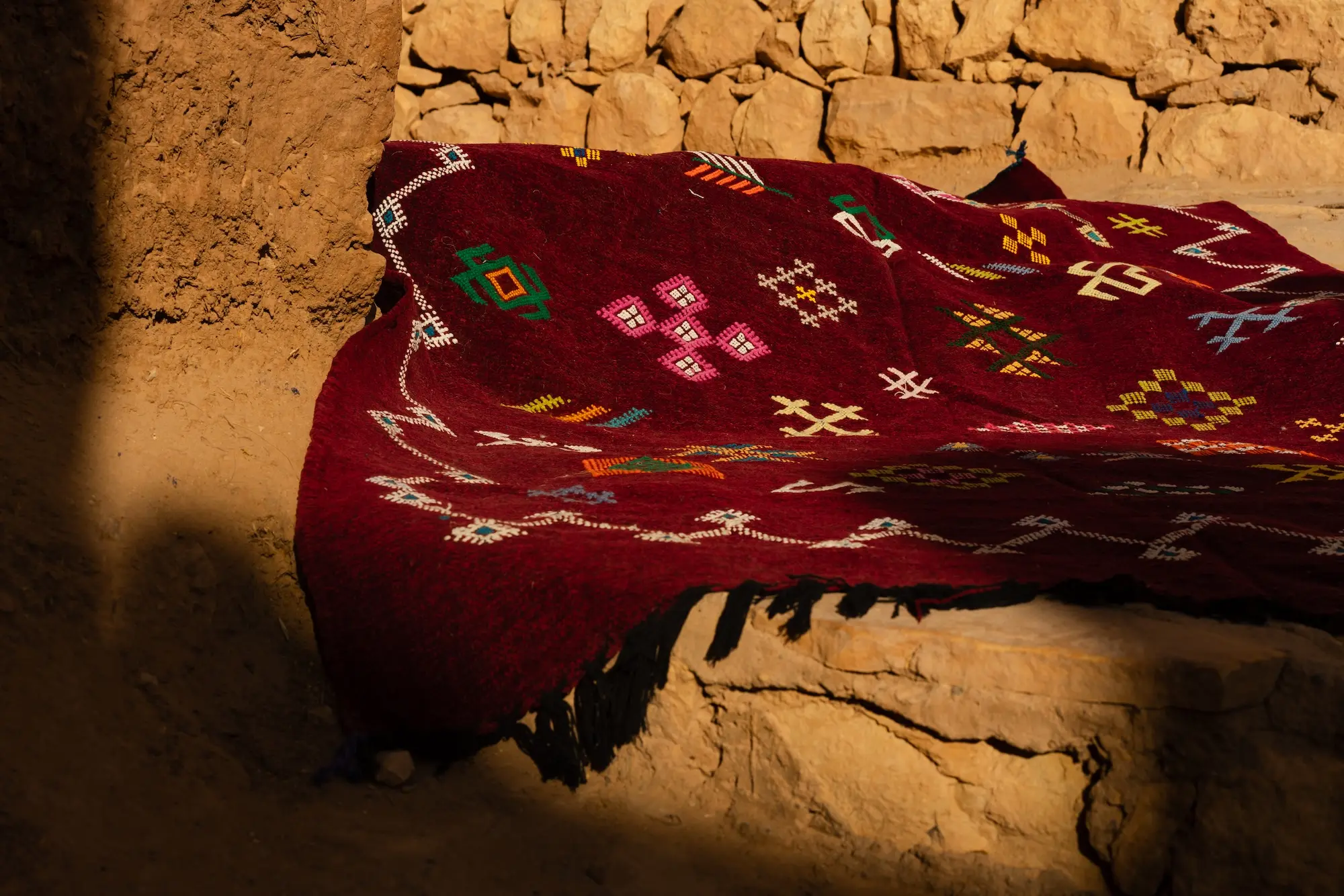 Details of a Moroccan rug, the Atlas Mountains, a red rug.