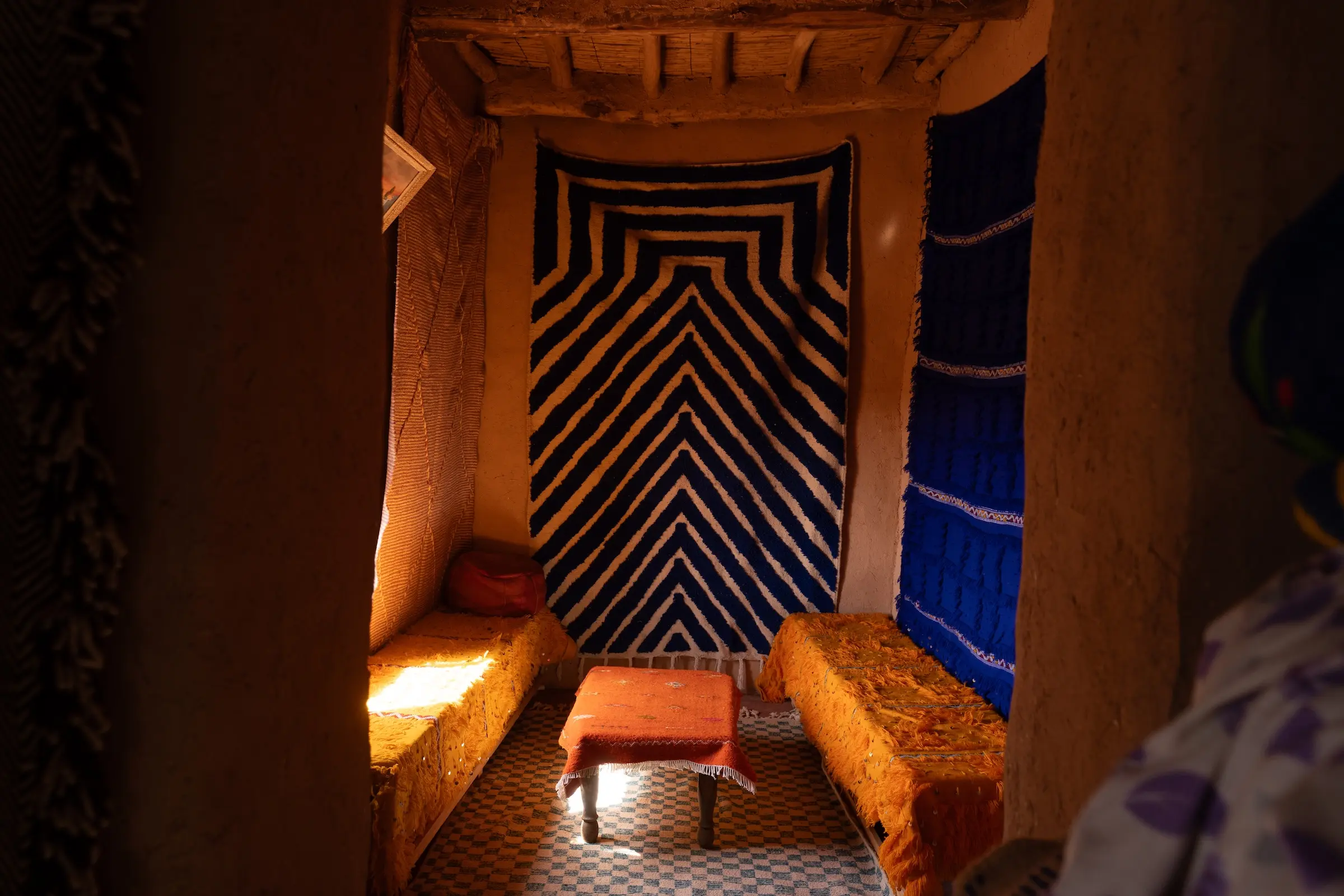 A couple of beds sitting next to each other in a room.