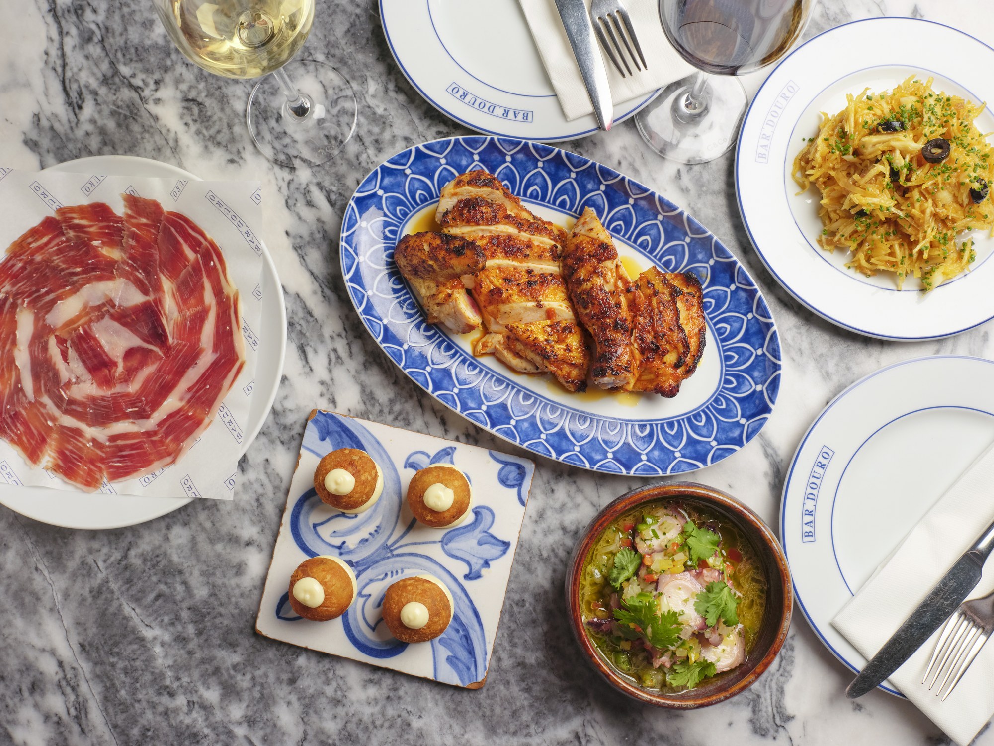 A spread of Bar Douro dishes on marble table for the Christmas group menu