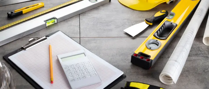 Picture with calculator, pencil and measuring tapes