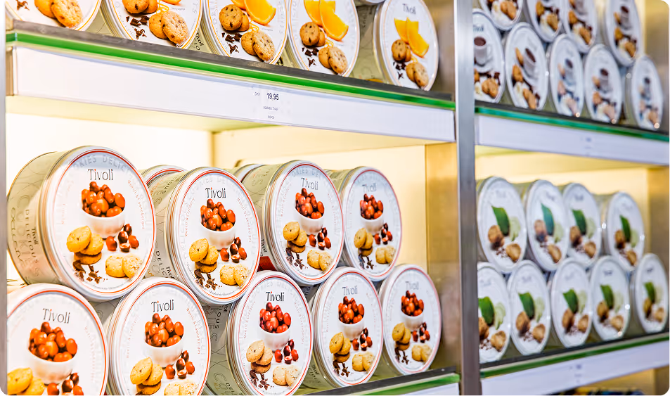 tin cans on a shelf with cookies