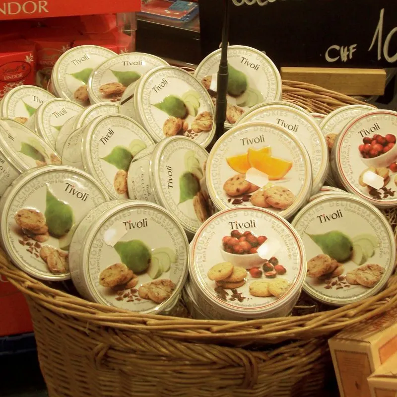 Basket filled with Tivoli cookie tins in a store in Germany