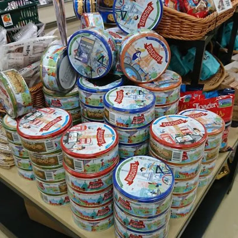 Pyramid of Danish butter cookie tins on a store display table in Japan