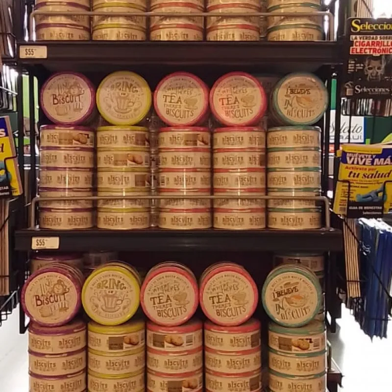 Tall shelving stacked with Danish cookie tins in a store in Mexico
