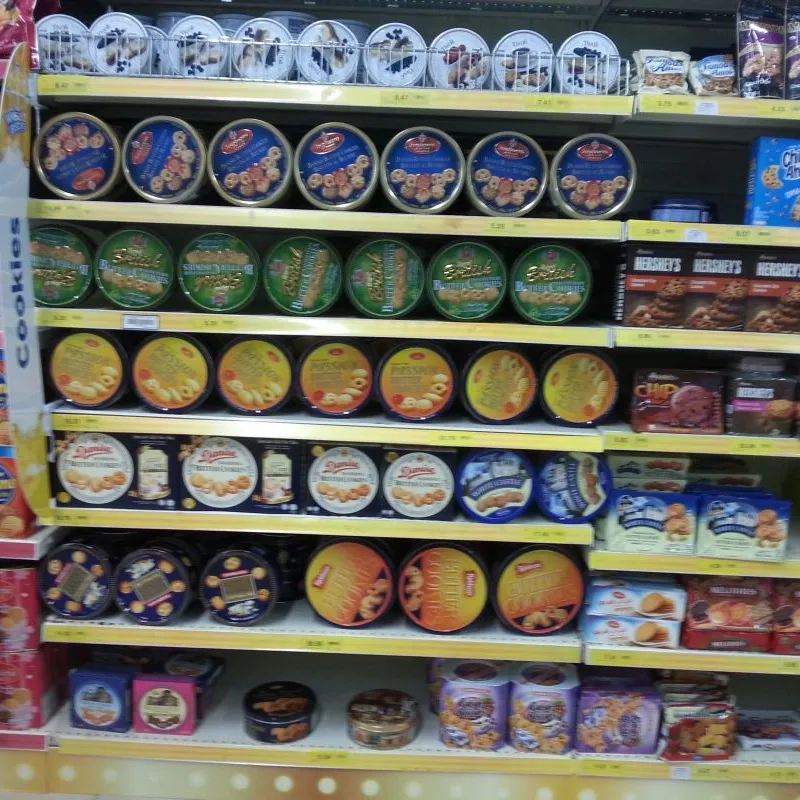 Long supermarket shelves stocked with Danish butter cookie tins in Malaysia