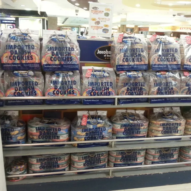 Shelves of Jacobsens shortbread cookie tins in a store in the Philippines