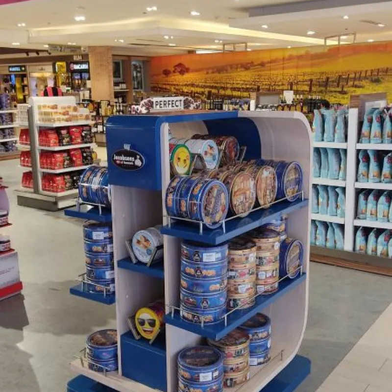 Curved Jacobsens of Denmark display stand with cookie tins in the Philippines