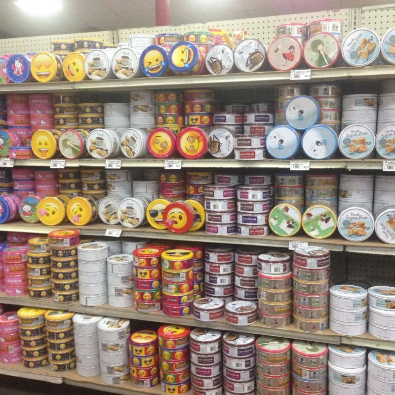 Long supermarket aisle stocked with colourful cookie tins in the Philippines