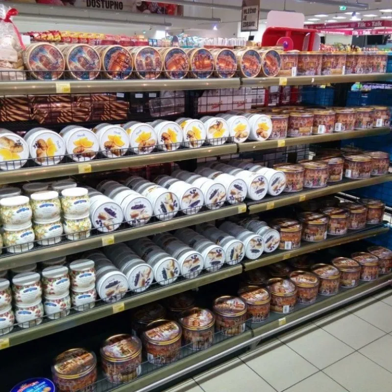Supermarket shelves stocked with Danish butter cookie tins in Serbia
