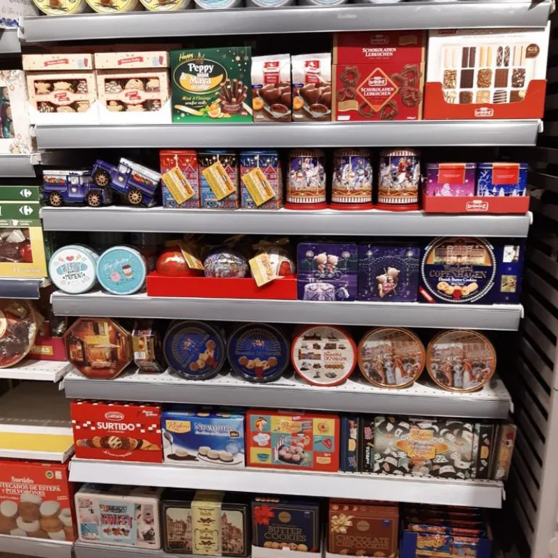 Shelves of Danish cookie tins and gift boxes in a store in Spain